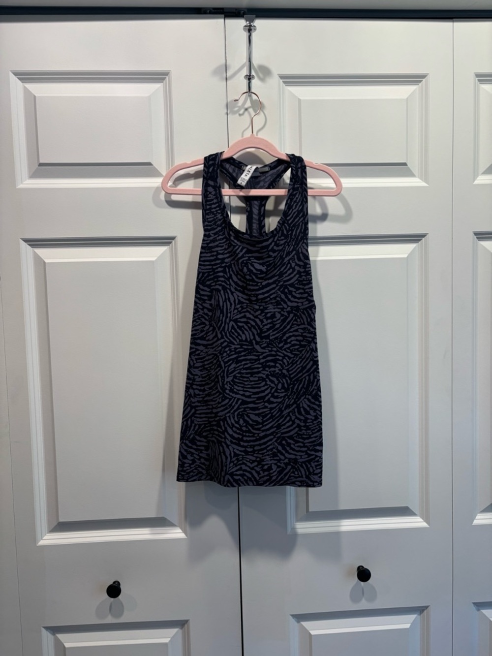 Athleta Racerback tank Black and blue patterned.